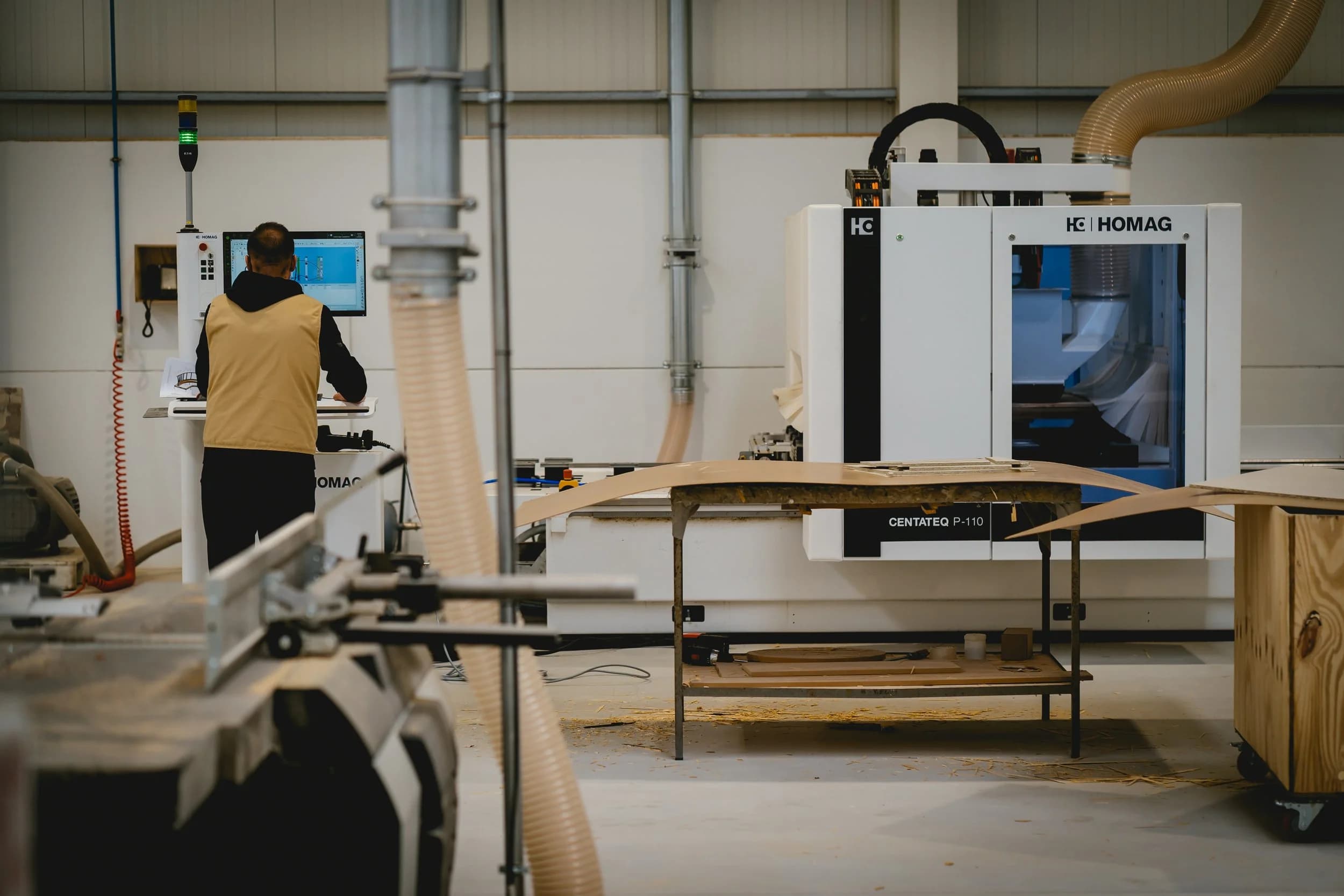 Artisan operating CNC machine