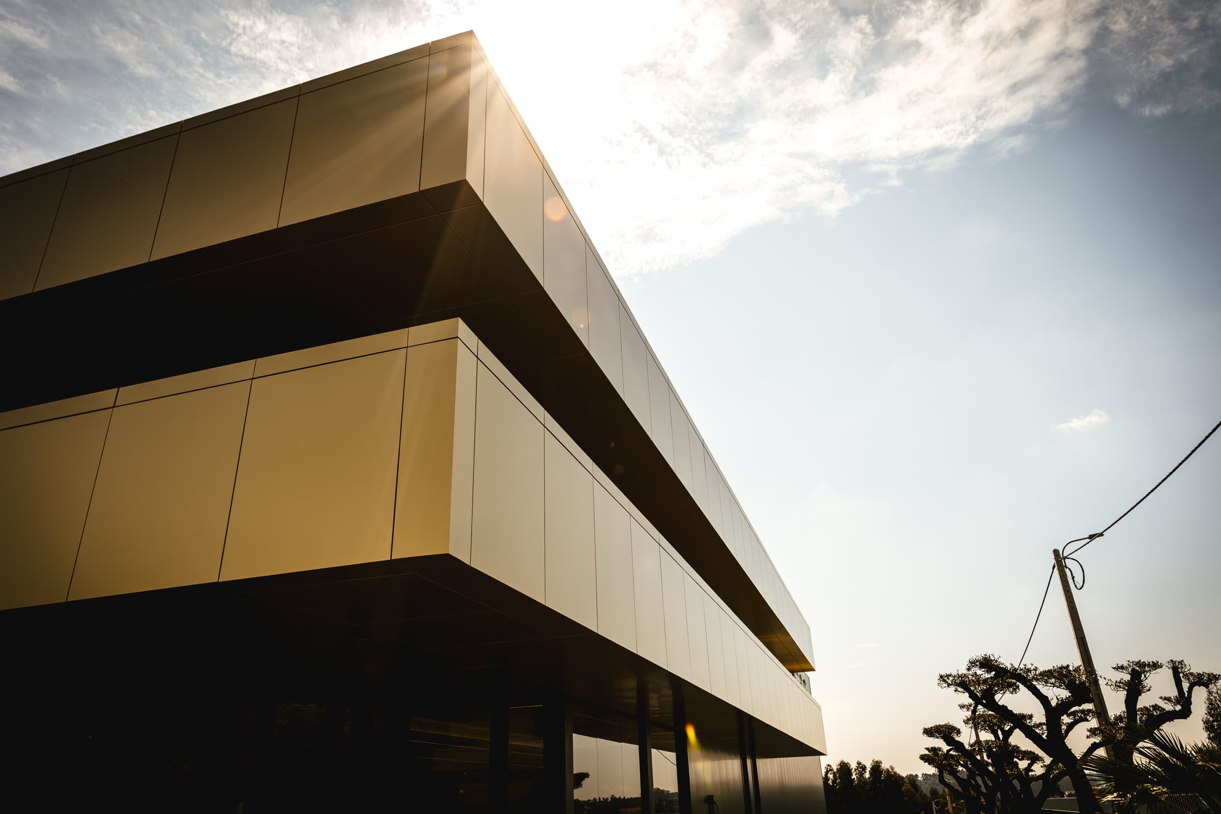 The Elbra building at golden hour — our atelier in Paços de Ferreira, Portugal